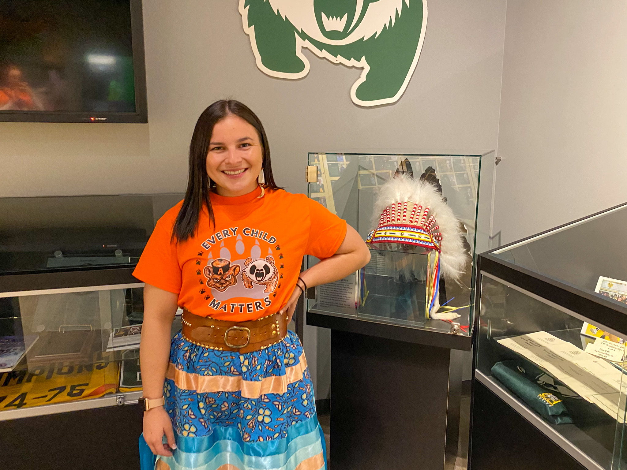 Pandas wrestling alumni Taylor McPherson designed a special orange shirt that will be worn by Alberta student-athletes in warmups this weekend. Photo by Connor Hood. Pandas wrestling alumni Taylor McPherson designed a special orange shirt that will be worn by Alberta student-athletes in warmups this weekend. Photo by Connor Hood.