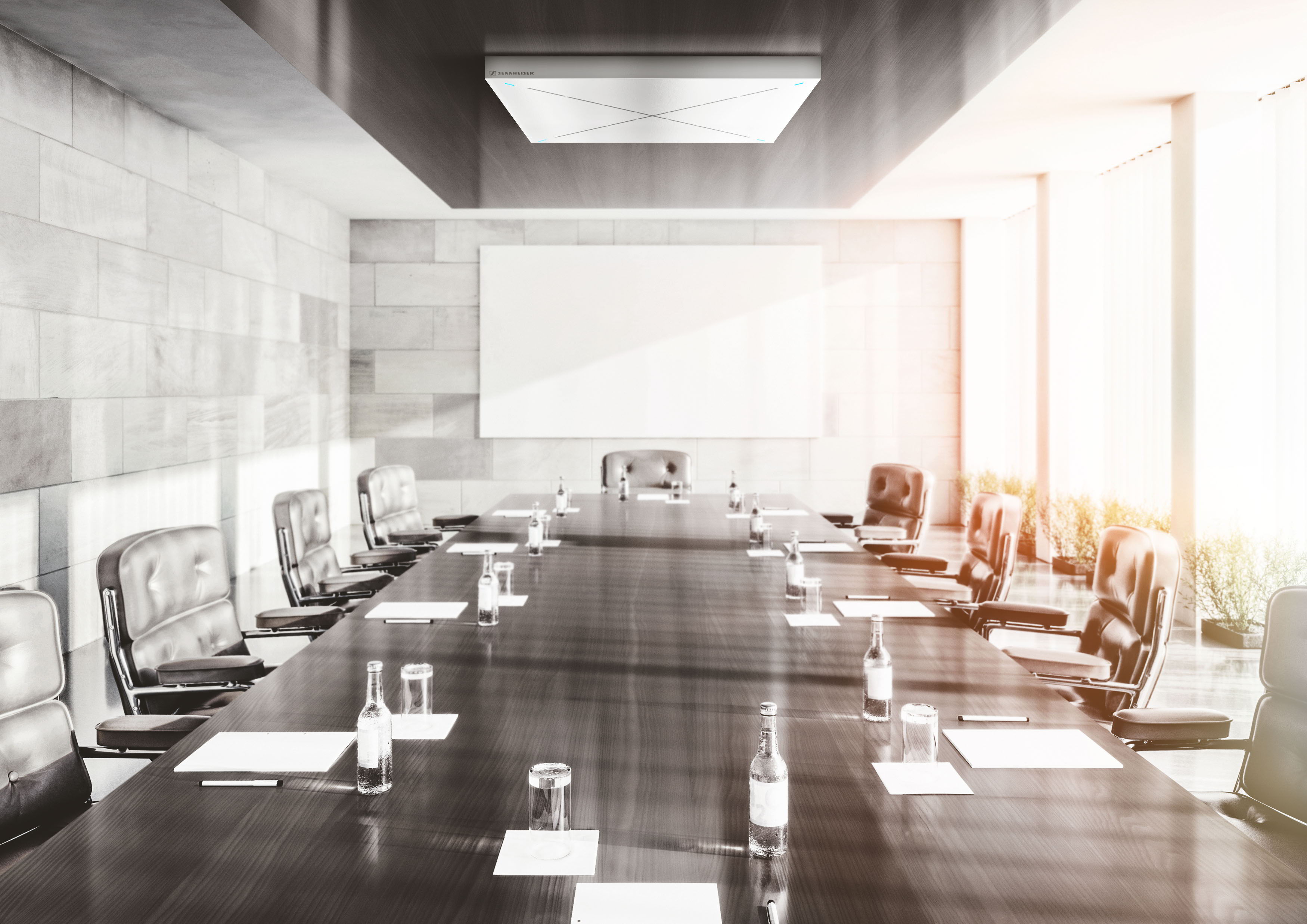 Ein minimalistisch gestalteter Meetingraum mit natürlichem Licht fördert die Konzentration aller Besprechungsteilnehmer.