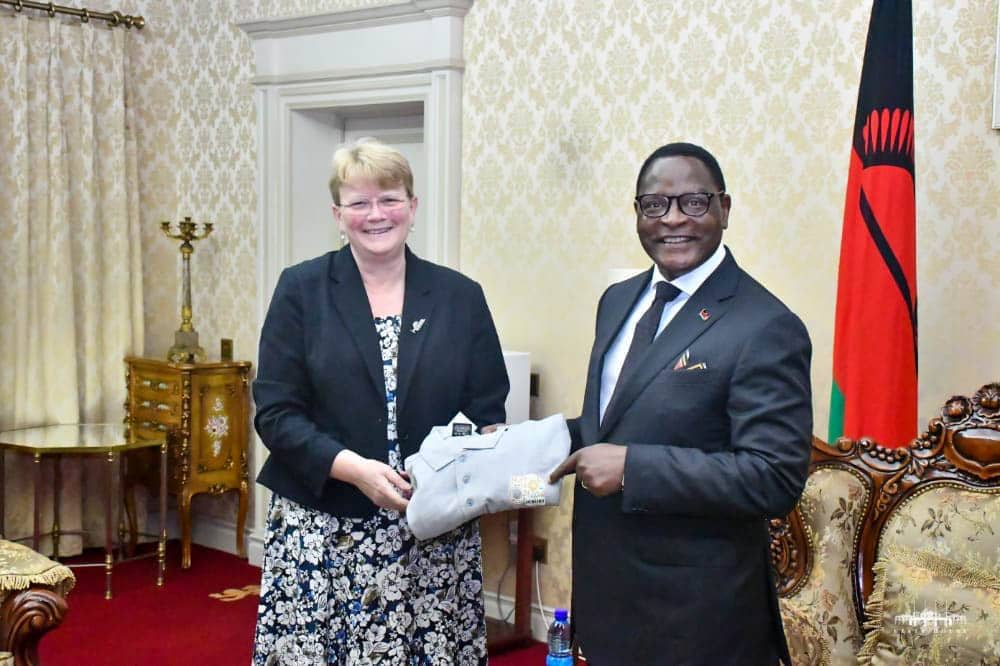 Dr Jacqueline Hughes presents ICRISAT@50 Golf Shirt to His Excellency Dr Lazarus Chakwera, President of Malawi
