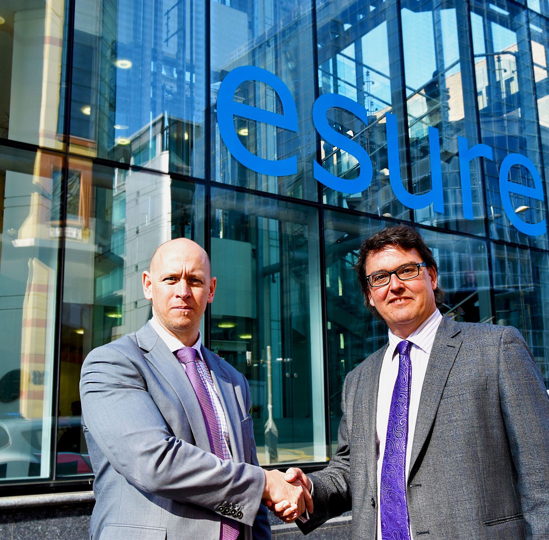 Jason Conway, Operations Delivery Leader and Richard Fuller, RAC’s Head of Commercial Sales seal the new partnership with a handshake outside esure’s Glasgow office. Jason Conway, Operations Delivery Leader and Richard Fuller, RAC’s Head of Commercial Sales seal the new partnership with a handshake outside esure’s Glasgow office.