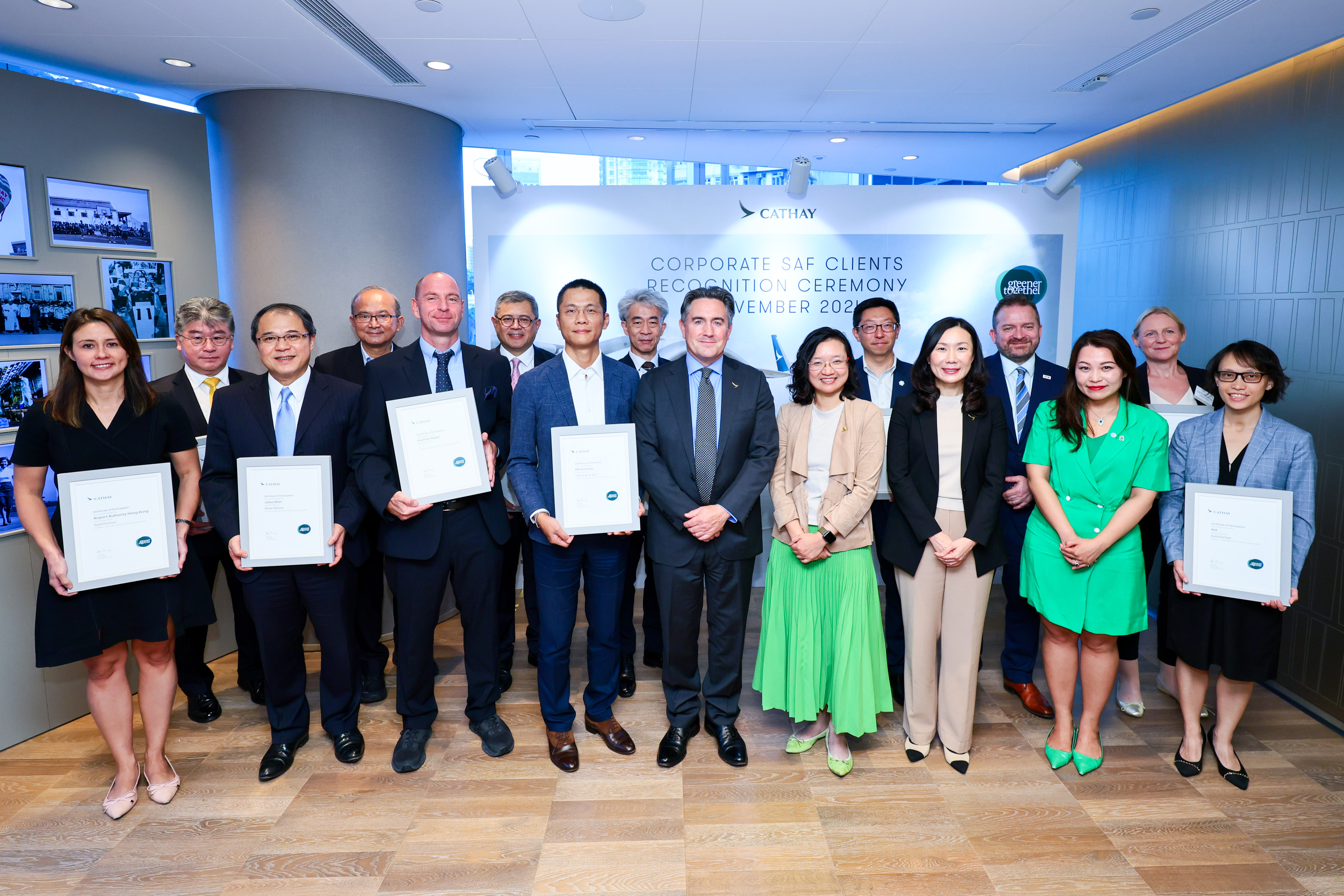 Cathay Director Customer Travel Erica Peng (front row, third from right), Cathay Director Cargo Tom Owen (front row, fifth from right), Cathay General Manager Group Sustainability Grace Cheung (front row, fourth from right) and Corporate SAF Programme partners celebrate the shared commitment in SAF usage.