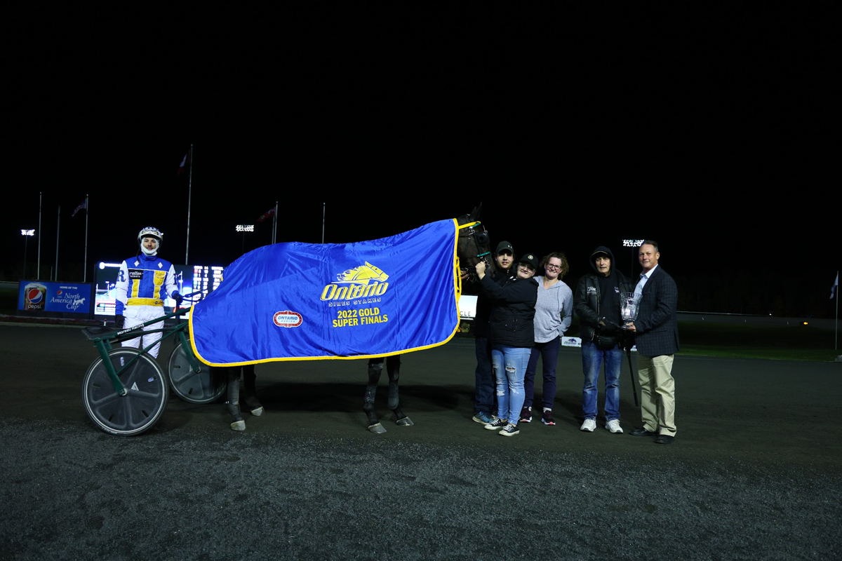 DWS Point Man and connections after winning the OSS Super Final for 2-year-old trotters on October 15, 2022 at Woodbine Mohawk Park (New Image Media)