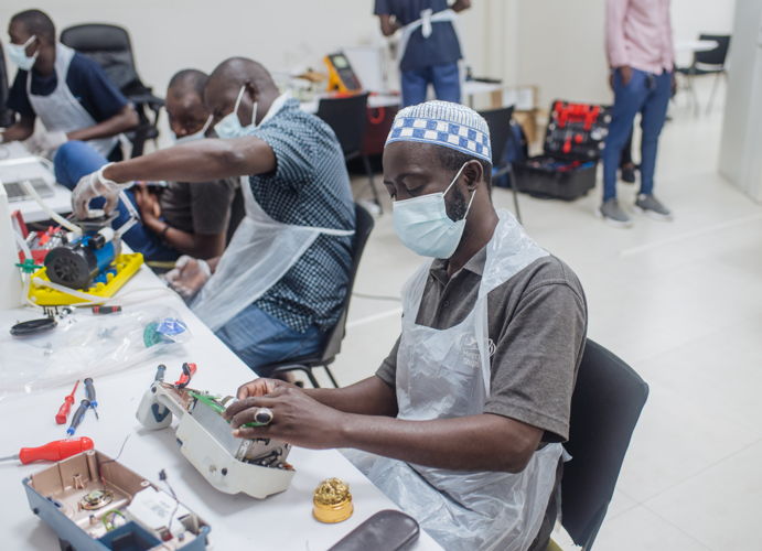 Toure Ibrahima, "Travel Biomed" from Senegal works on a simulator during the Biomedical capacity building course with Mercy Ships in Dakar.