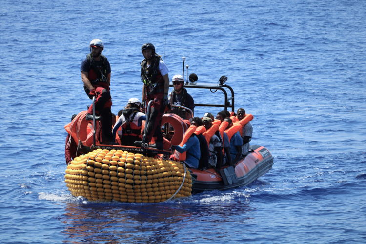 The SOS Mediterranee rescue team on board the RHIB (rigid hull inflatable boat) bring people from a rubber boat in distress to the Ocean Viking.
Copyright: MSF/Hannah Wallace Bowman