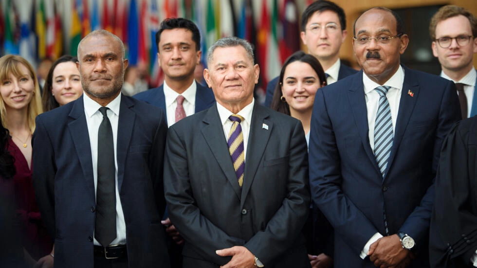 Prime Minister of Antigua and Barbuda Gaston Browne, Attorney General of Vanuatu Arnold Loughman, and Prime Minister of Tuvalu Kausea Natano pictured at a hearing of the International Tribunal for the Law of the Seas (ITLOS) on September 11, 2023 in Hamburg, Germany. © Gregor Fischer, AFP