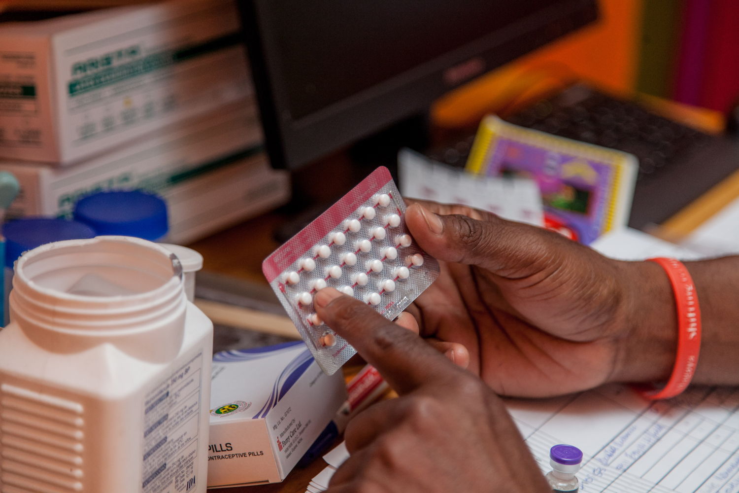 A nurse gives instruction on how to take contraceptive pills. Photographer: Charmaine Chitate 