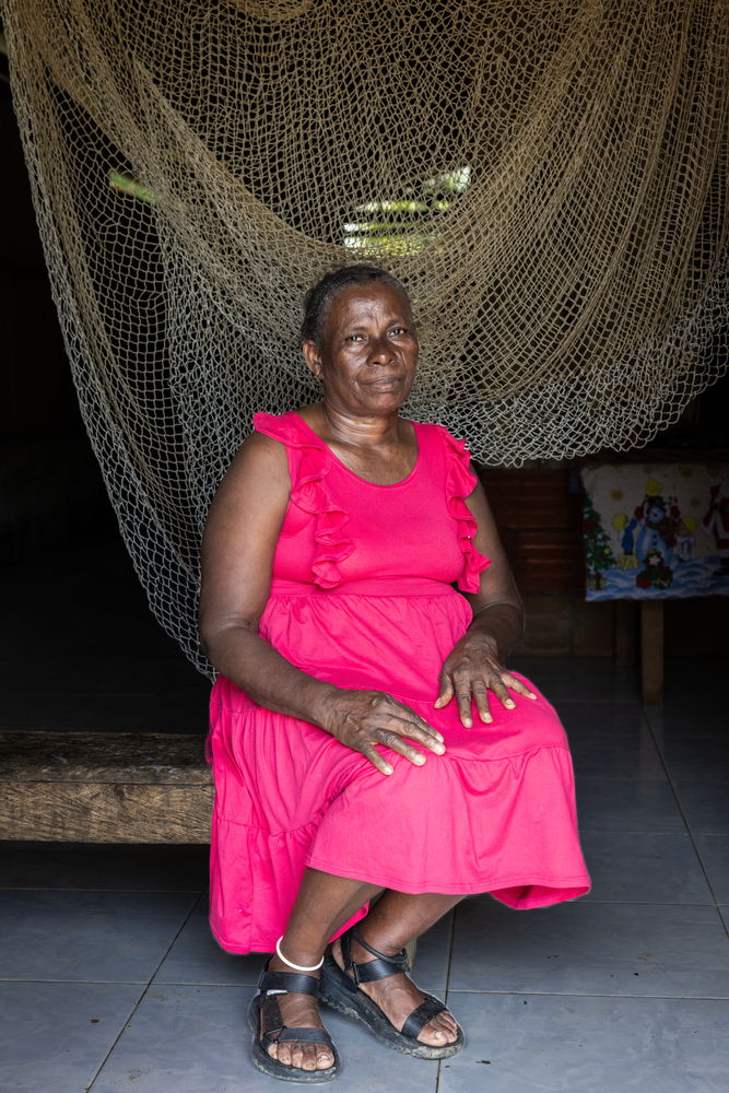 Traditional healer Carmen Fidela Mena, from the community of Chachajo, Alto Baudó, Chocó. In Riverographies of Baudó, seven healers and midwives symbolically healed the wounds of their territory. Each woman healer tore an image of the place she wanted to heal and then, in the same way she has kept her community healthy, applied herbs and sutures to heal it.