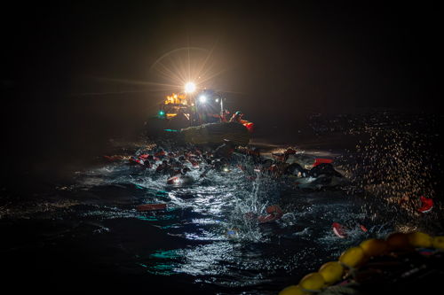 This pictures captures the harrowing moment an overcrowded boat capsized last night. Luckily, the @MSF team managed to retrieve all 45 people safely from the water. Copyright: Simone Boccaccio