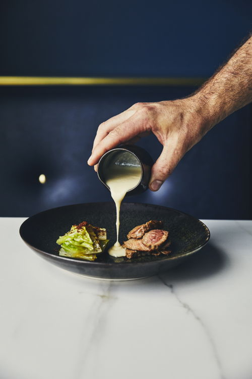 ARVI - The veal rib-eye and seared romaine gets sauced with two-year-old cheddar
(Maude Chauvin/Air Canada enRoute magazine)