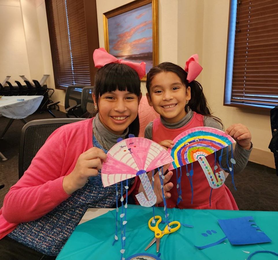 Two sisters work on an umbrella craft at Spring Thing! Two sisters work on an umbrella craft at Spring Thing!