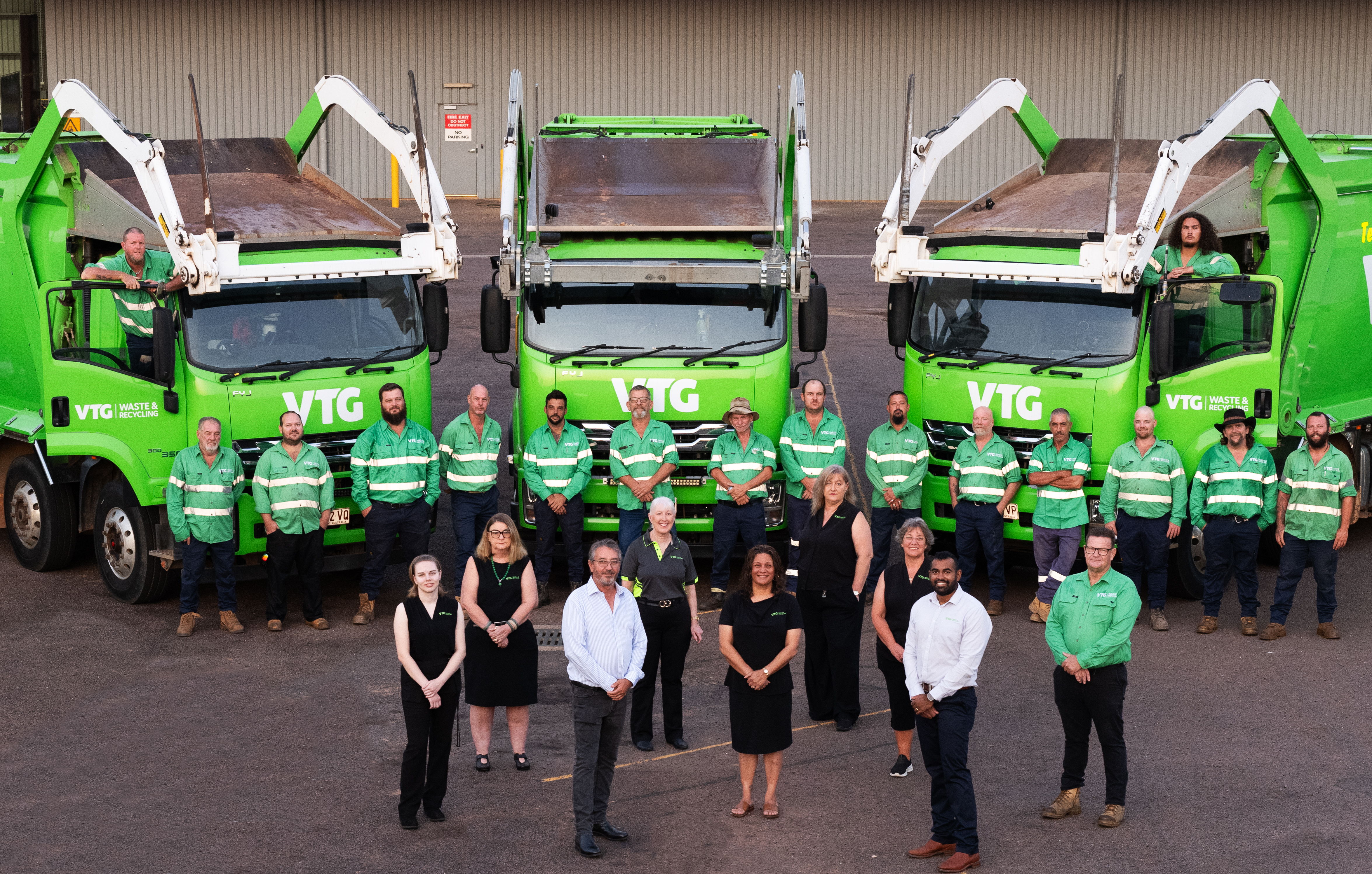 Director Mark Sweet (front left) with Managing Director James Prakash (front right) and the VTG Waste & Recycling team proudly present their fleet
