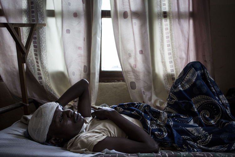 Myime Richards (32), recovers in a hospital room on 2 March 2018 in Bunia. He lost his wife, three of his four children and suffered servere lacerations to his head and neck after an attack on his village. Fighting in Ituri province has left thousands of Congolese displaced and some 100 have lost their lives. PHOTO/JOHN WESSELS