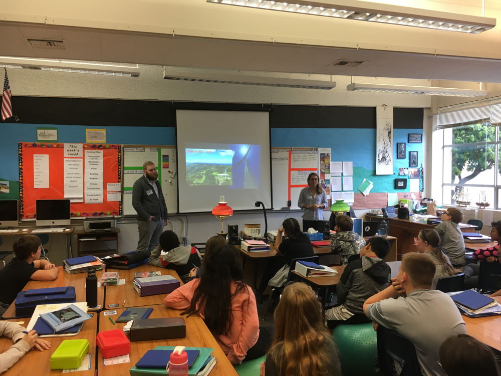 Teacher, Dylan McCann, guides his students at Twality Middle School in Tigard, Oregon through a STEM lesson and brings in industry experts to her class virtually using Nepris or for in-class visits using Oregon Connections.