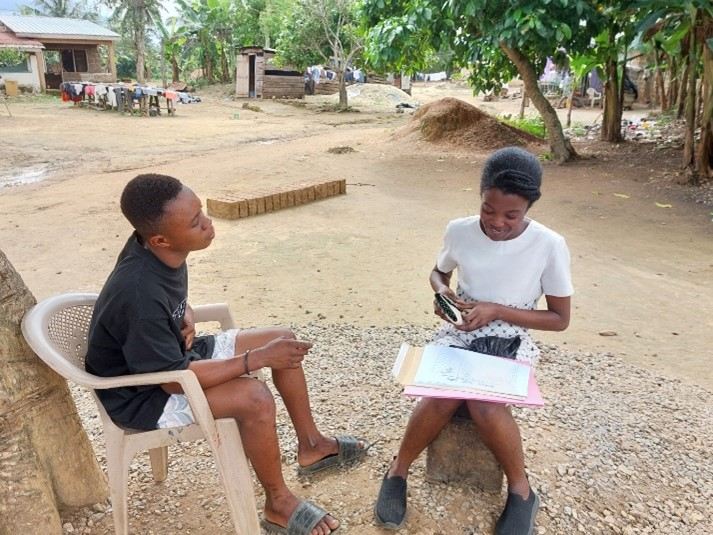 From right to left: A surveyor from environmental CERSGIS during an interview with a miner in Ghana. Photo. CERSGIS