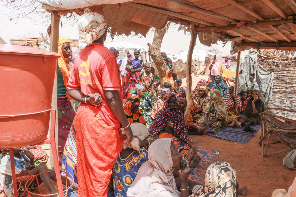 In a camp for internally displaced persons in the city of Gorom-Gorom, in the Sahel region of Burkina Faso, women gather to meet with MSF health promotion teams to discuss issues of access to healthcare. Photographer: Mohamed El-Habib Cisse 