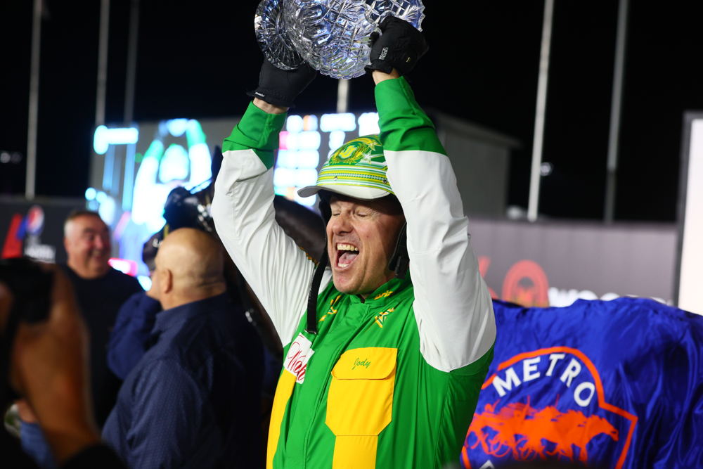Jody Jamieson with the Metro Pace trophy at Woodbine Mohawk Park (New Image Media)