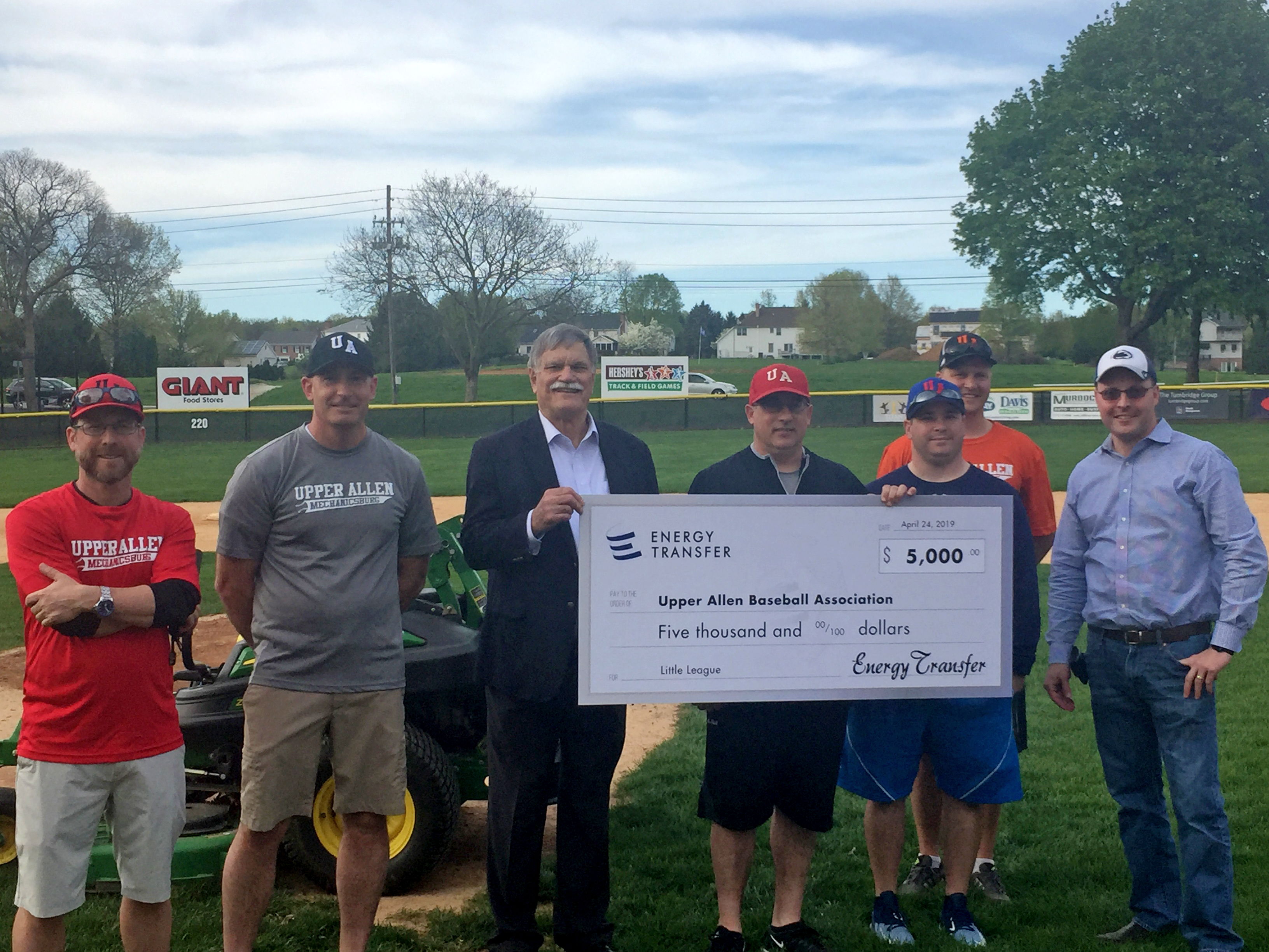 The Upper Allen Mechanicsburg Baseball Association receives a check for $5,000 from Energy Transfer
