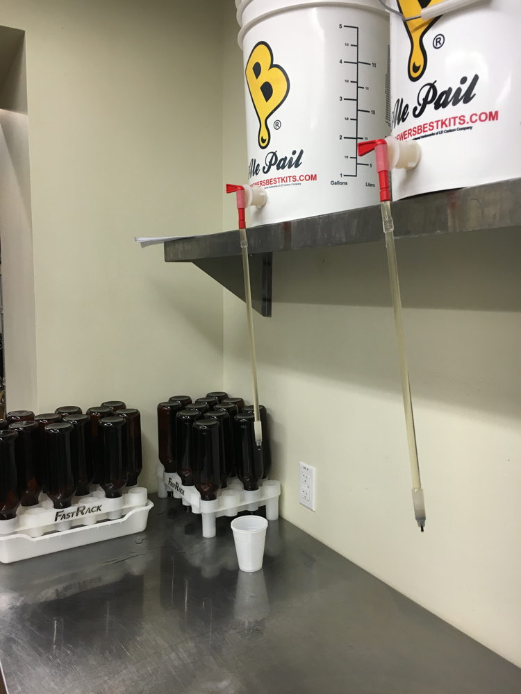 Bottling buckets full of Worth the Wait Cantaloupe Gose fill 48, 22-ounce bombers.