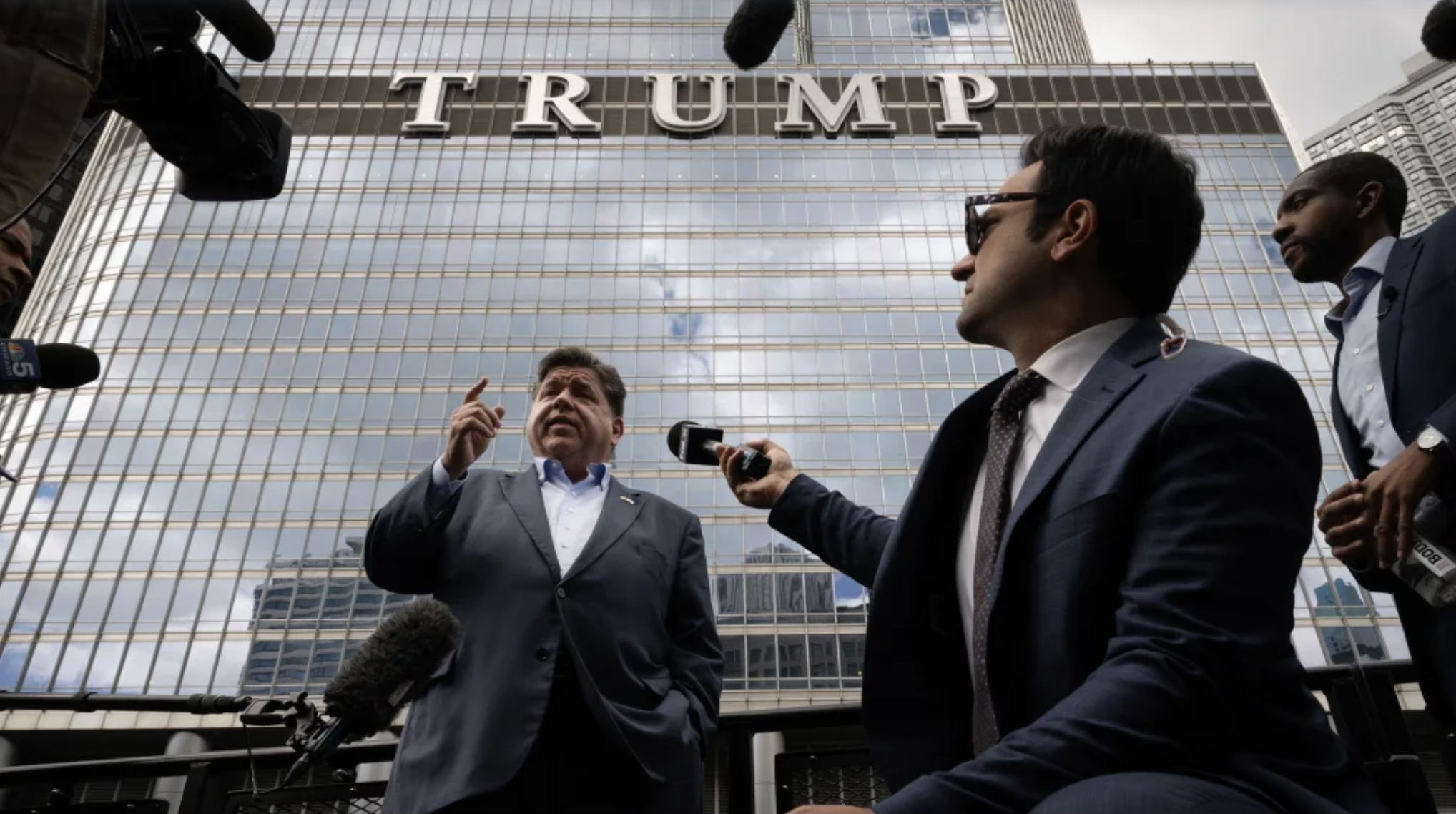 Gov. Pritzker talks to reporters on a Chicago River water taxi. (Scott Olson/Getty Images)