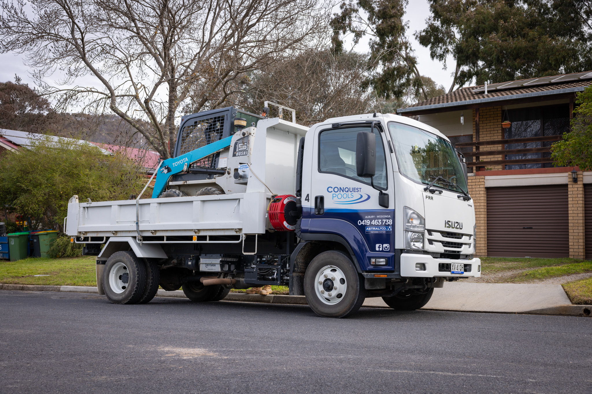 One of Conquest Pools' Isuzu FRR tippers