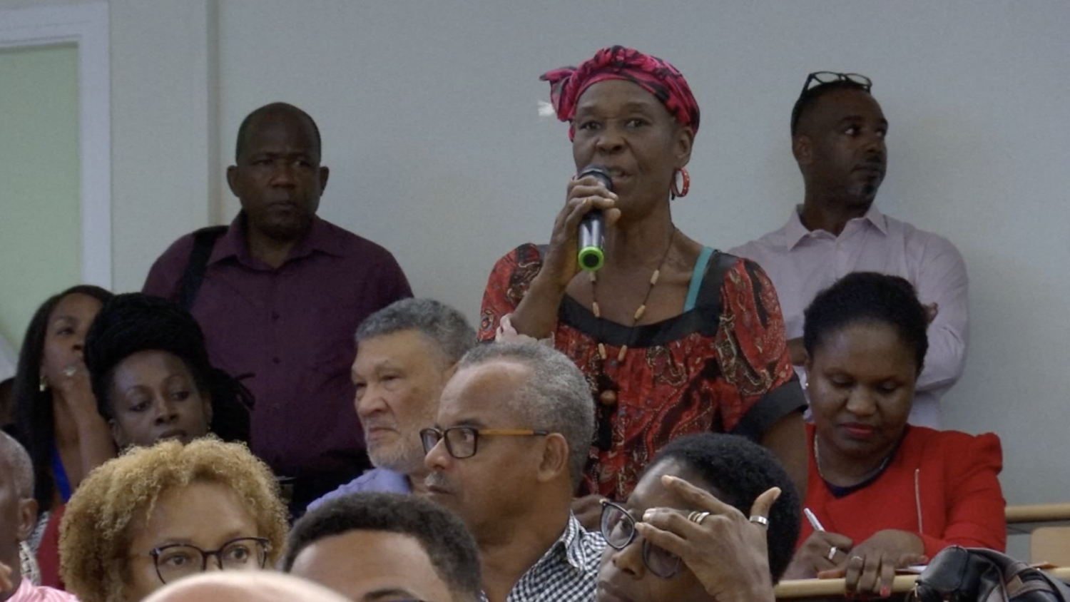 An audience member asks a question of the panel