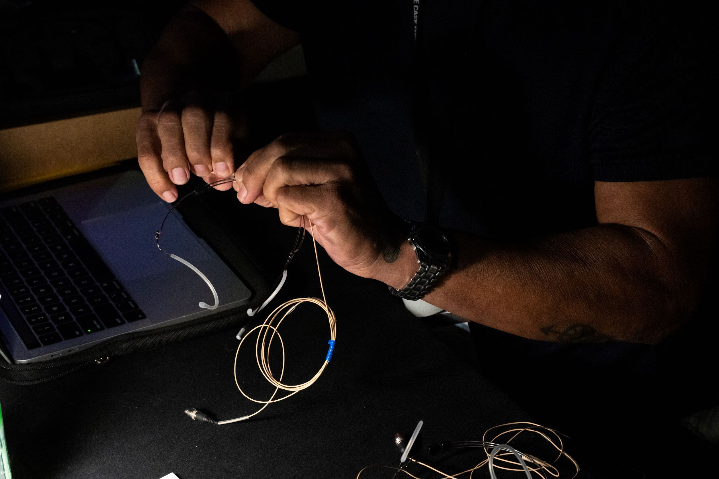 The custom headset microphones are prepared backstage at TEDMonterey 2021