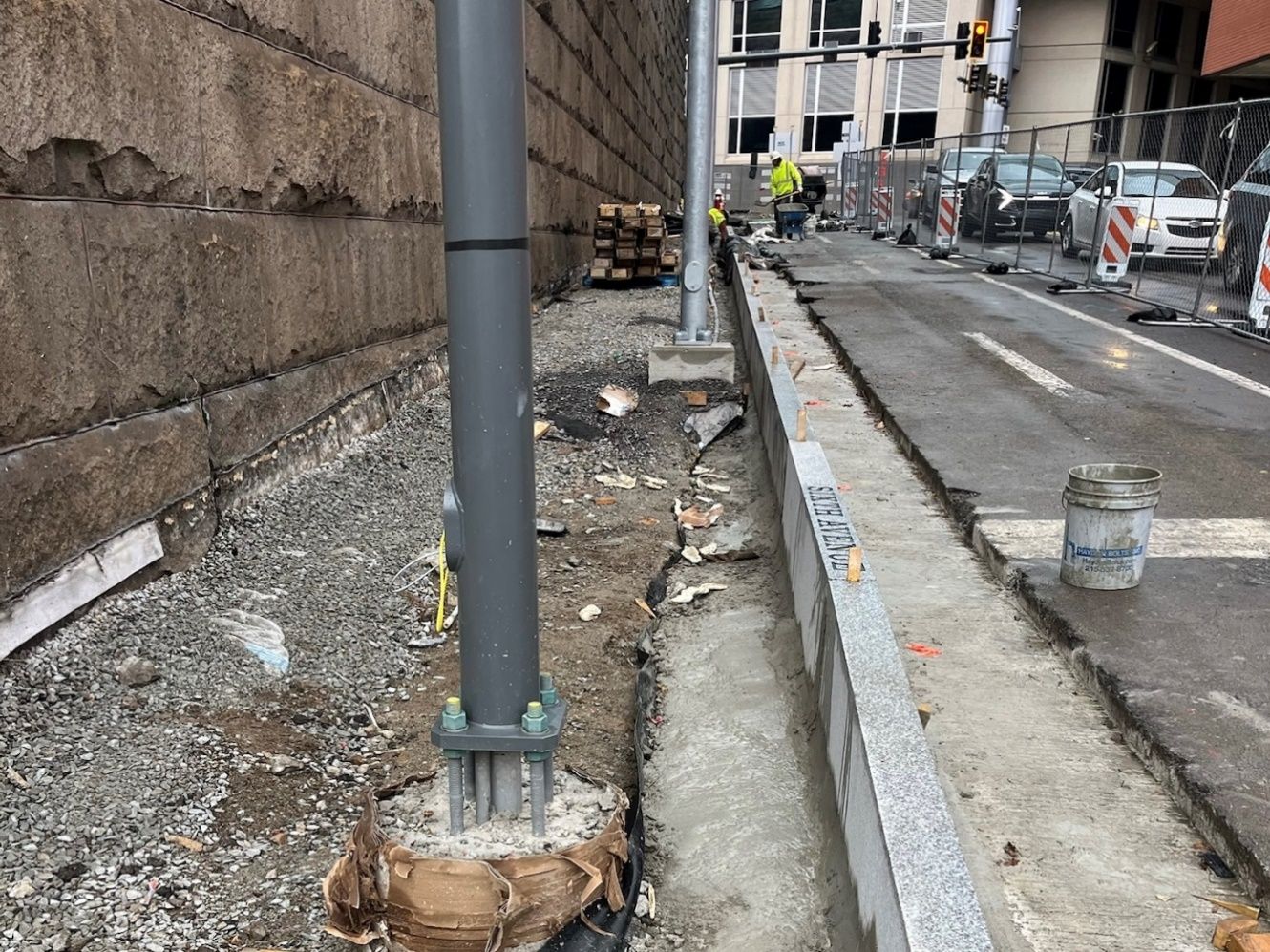 Granite curbs being installed at Sixth and Diamond Street