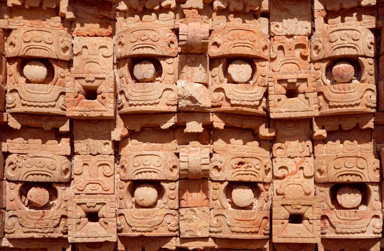 Detail of the western façade of the Codz Poop ('Rolled-up matting' in Maya), originally covered with 250 stone masks of Chaac, the big-nosed god of rain, Puuc Architecture, AKG1637361 © akg-images / Manuel Cohen