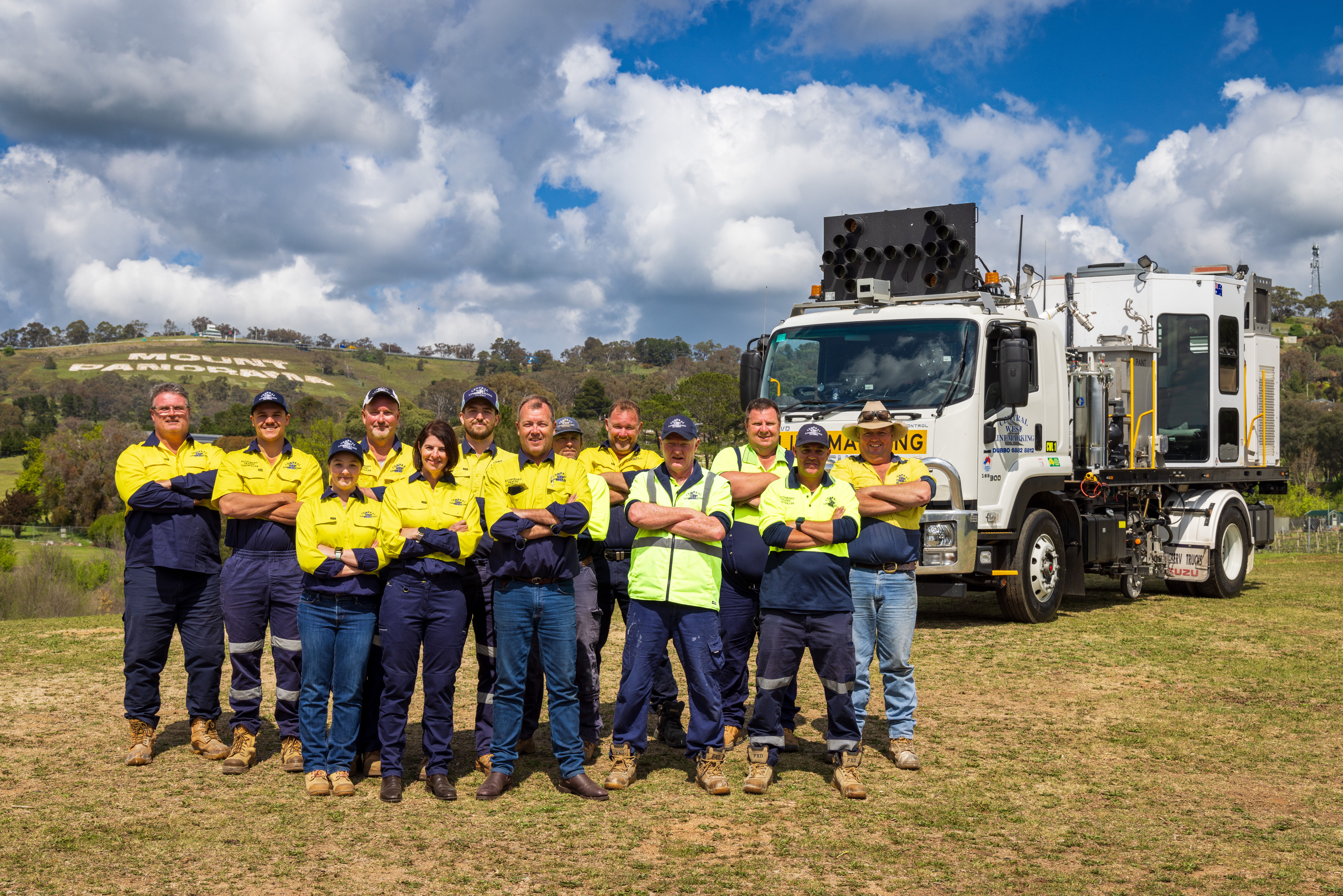 Lana Walker & Adam Walker (front centre) are proud of the business they have built with the help of their loyal staff team