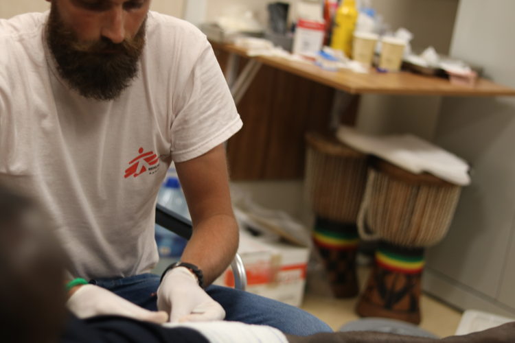 MSF Doctor Luca Pigozzi on board Ocean Viking treats a rescued person for an infection in his upper leg, caused by exposure to unsanitary living conditions for an extended period of time.
Copyright: Hannah Wallace Bowman/MSF