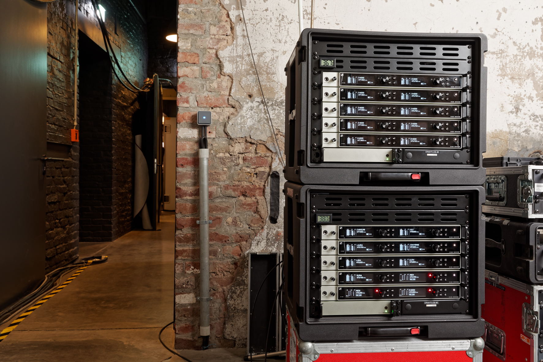 The 19” racks hold the Sennheiser EM 6000 DANTE receivers