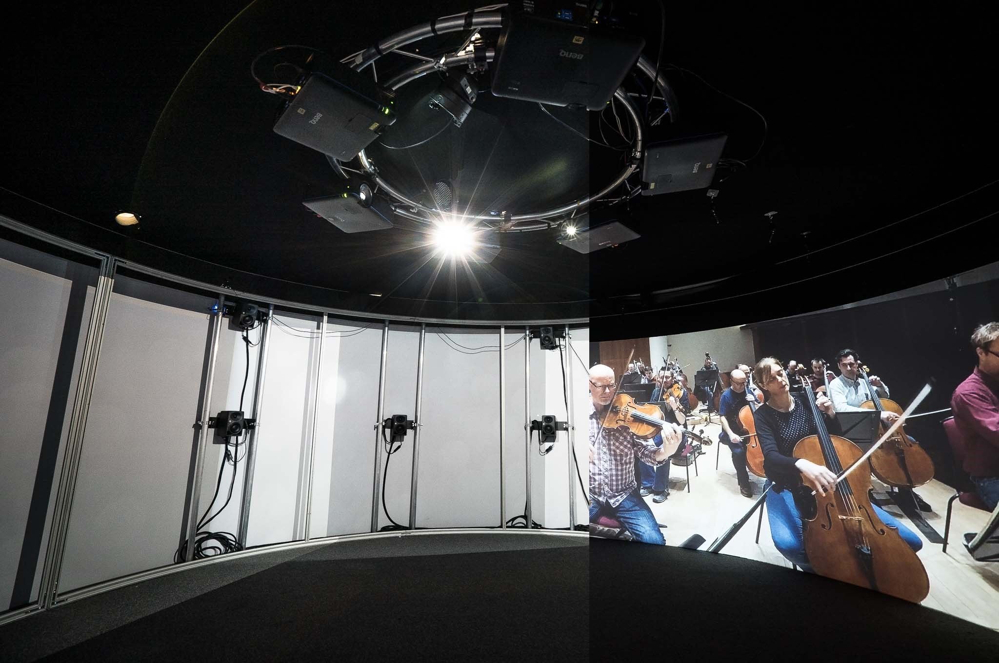 The Neumann KH 80 DSP loudspeakers are set up in a 9.1 arrangement behind the acoustically transparent screen of the Igloo cylinder, fully enveloping visitors in the orchestra sound The Neumann KH 80 DSP loudspeakers are set up in a 9.1 arrangement behind the acoustically transparent screen of the Igloo cylinder, fully enveloping visitors in the orchestra sound
