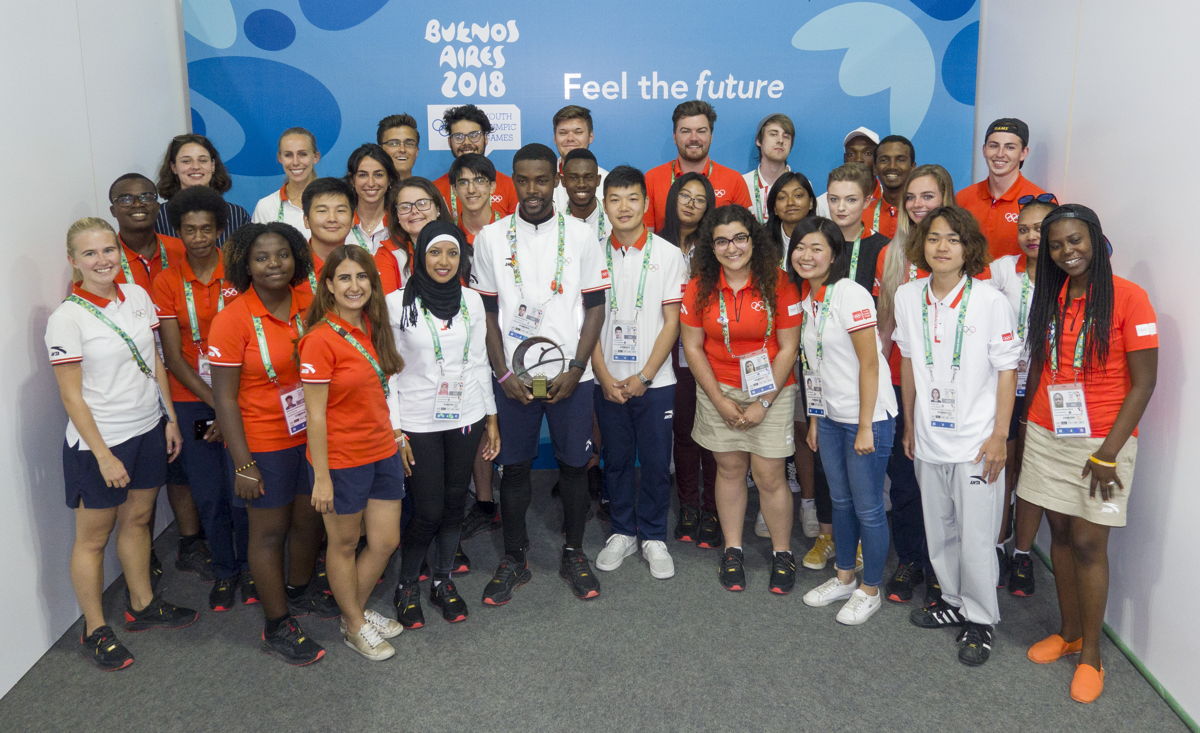 Sharome pictured with the IOC YR class of 2018, featuring the top Young Reporters from the Americas, Europe, Africa, Oceania and Asia.