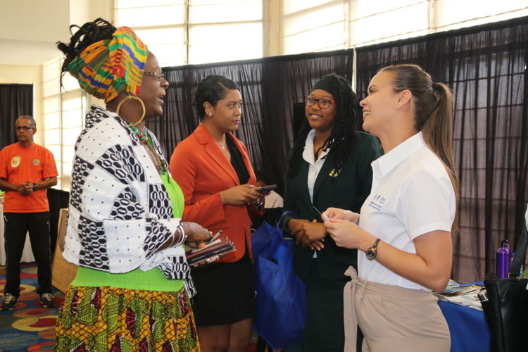 Visitors to the Biodiversity Exposition converse with the IUCN Team.