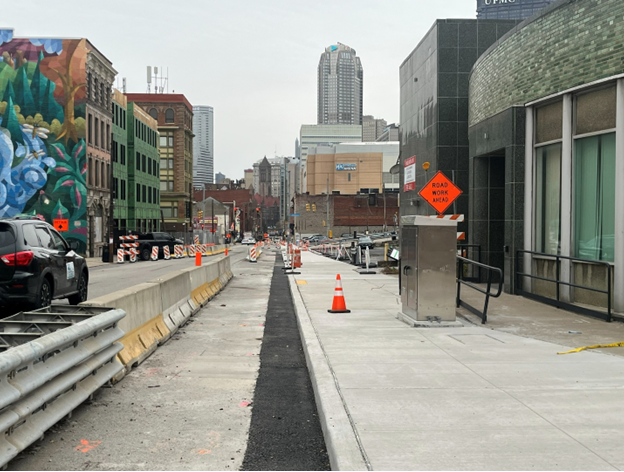 New concrete sidewalks recently poured at Fifth Avenue and Pride Street