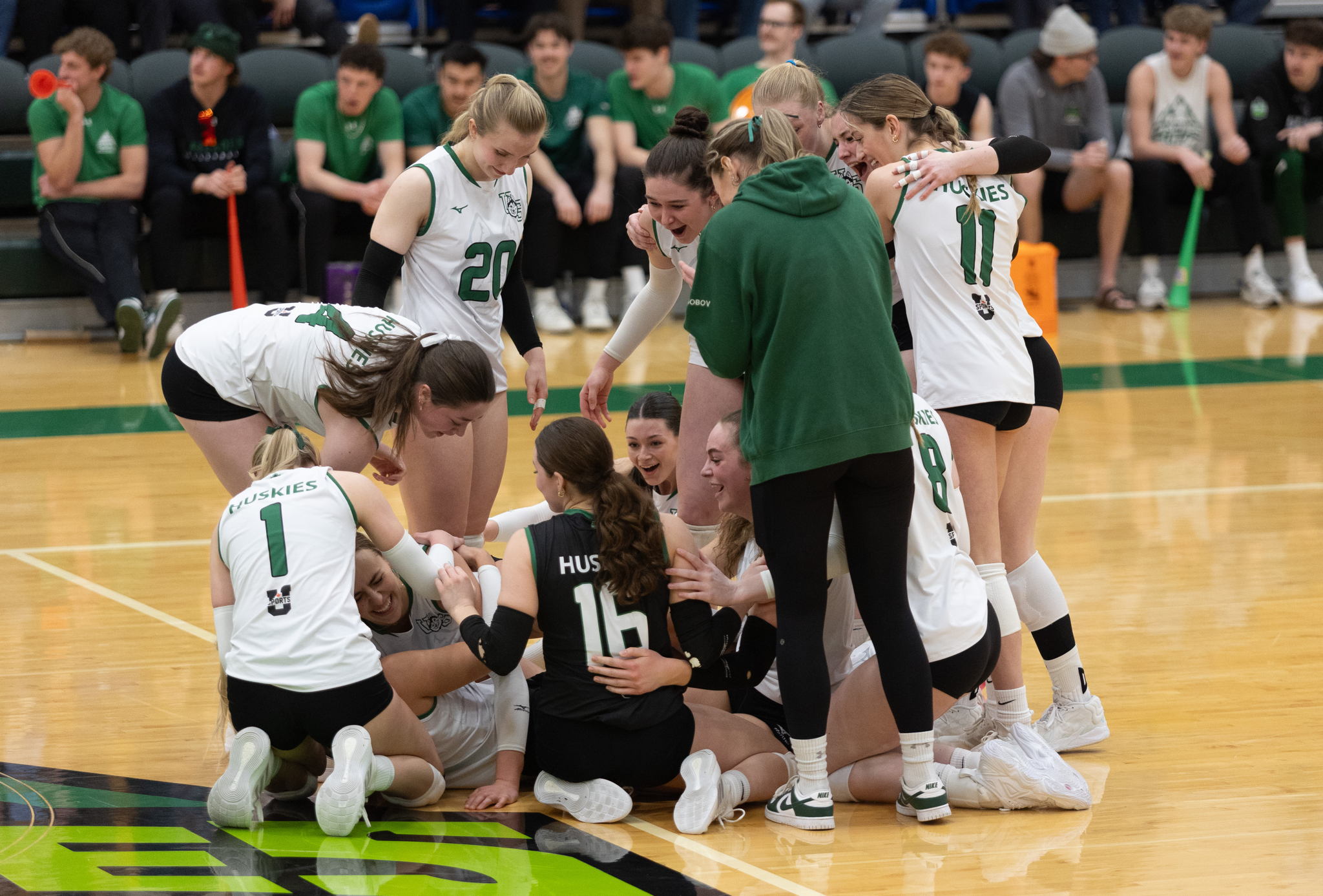 The Huskies celebrate after defeating UFV in the quarterfinals. Photo by Jordie Arthur.