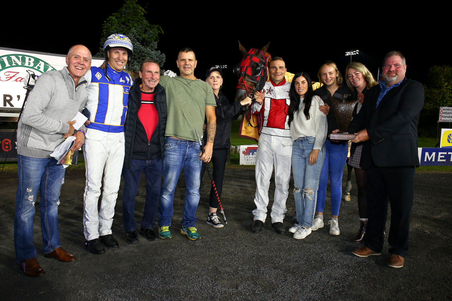 Connections of It's a Love Thing in the winner's circle for the She's a Great Lady trophy at Woodbine Mohawk Park (New Image Media)