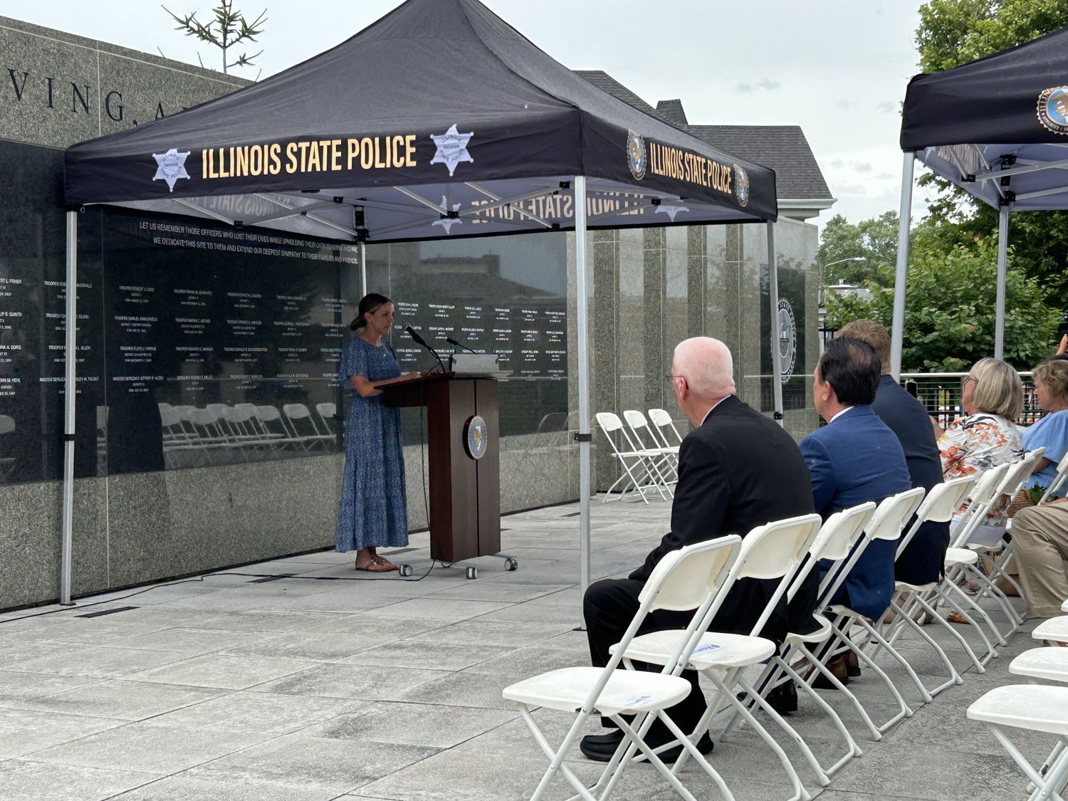 Wife Meghan Carns speaks at ISP Memorial Wall ceremony.