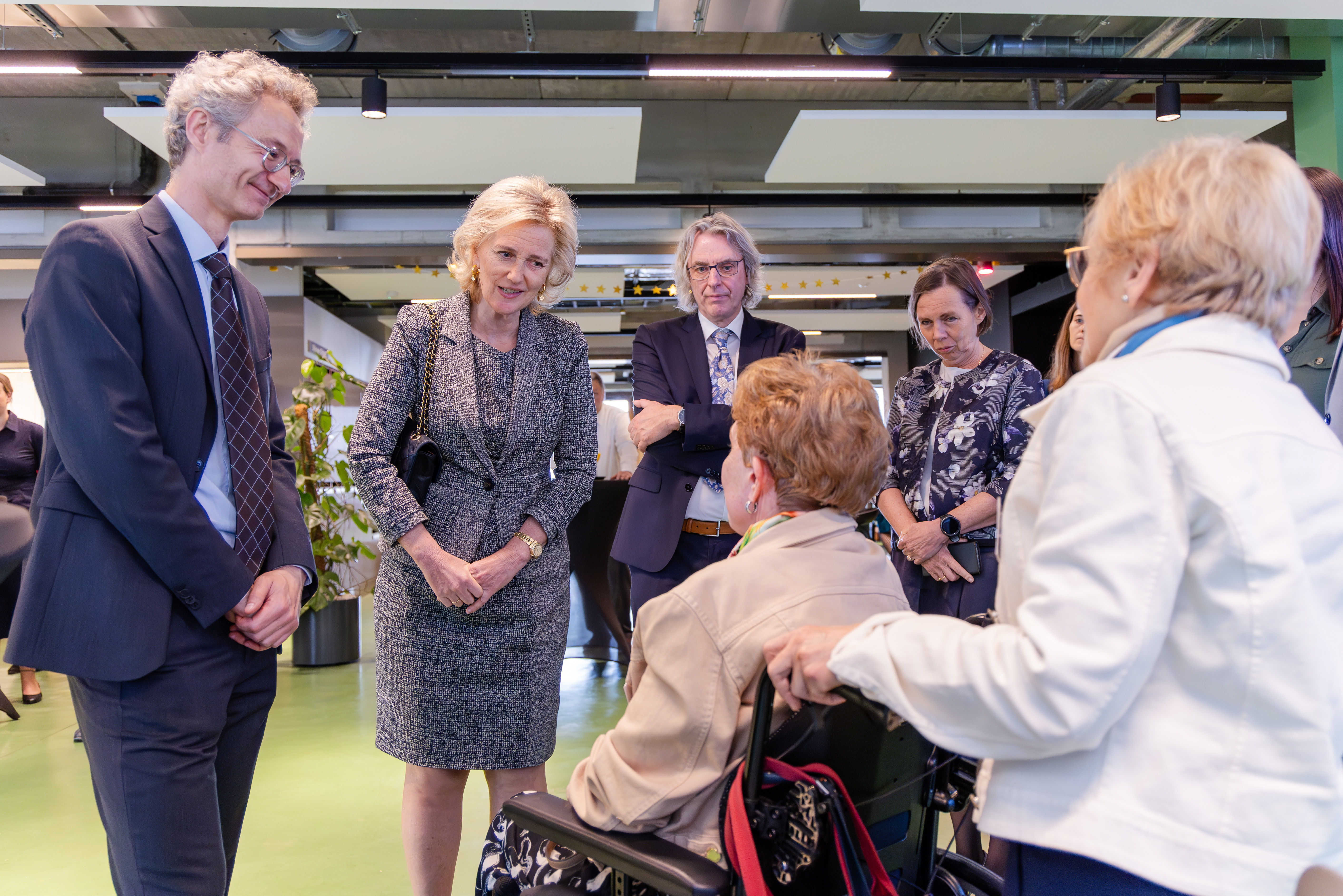 Princess Astrid, Prof. Philip Van Damme (left), and Prof. Ludo Van Den Bosch (right) interacting with ALS Patients. ©️Geert Vanden Wijngaert