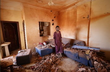 A man standing in his destroyed house in Khartoum. April 2023