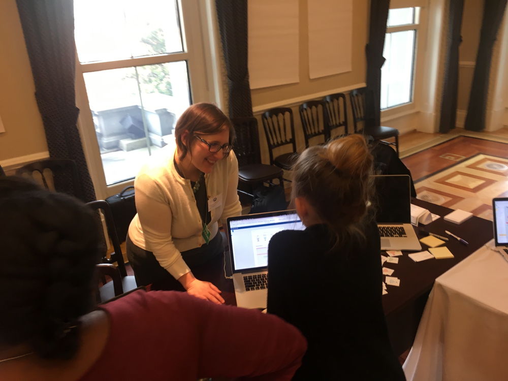 Turnitin's Stephanie Butler looks on while a student tries out Turnitin Revision Assistant at the White House Innovative Assessment Tech Jam on December 8.