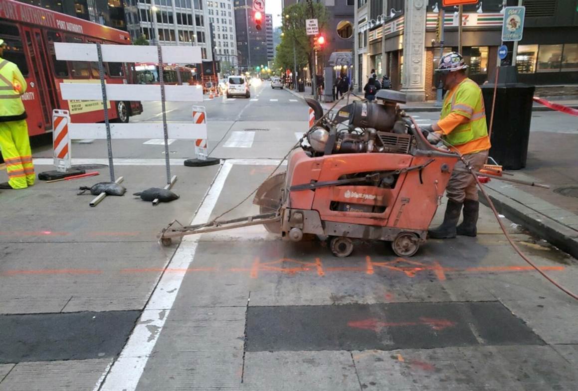 Saw-Cutting the Roadway to Place Conduits for Electricity Saw-Cutting the Roadway to Place Conduits for Electricity