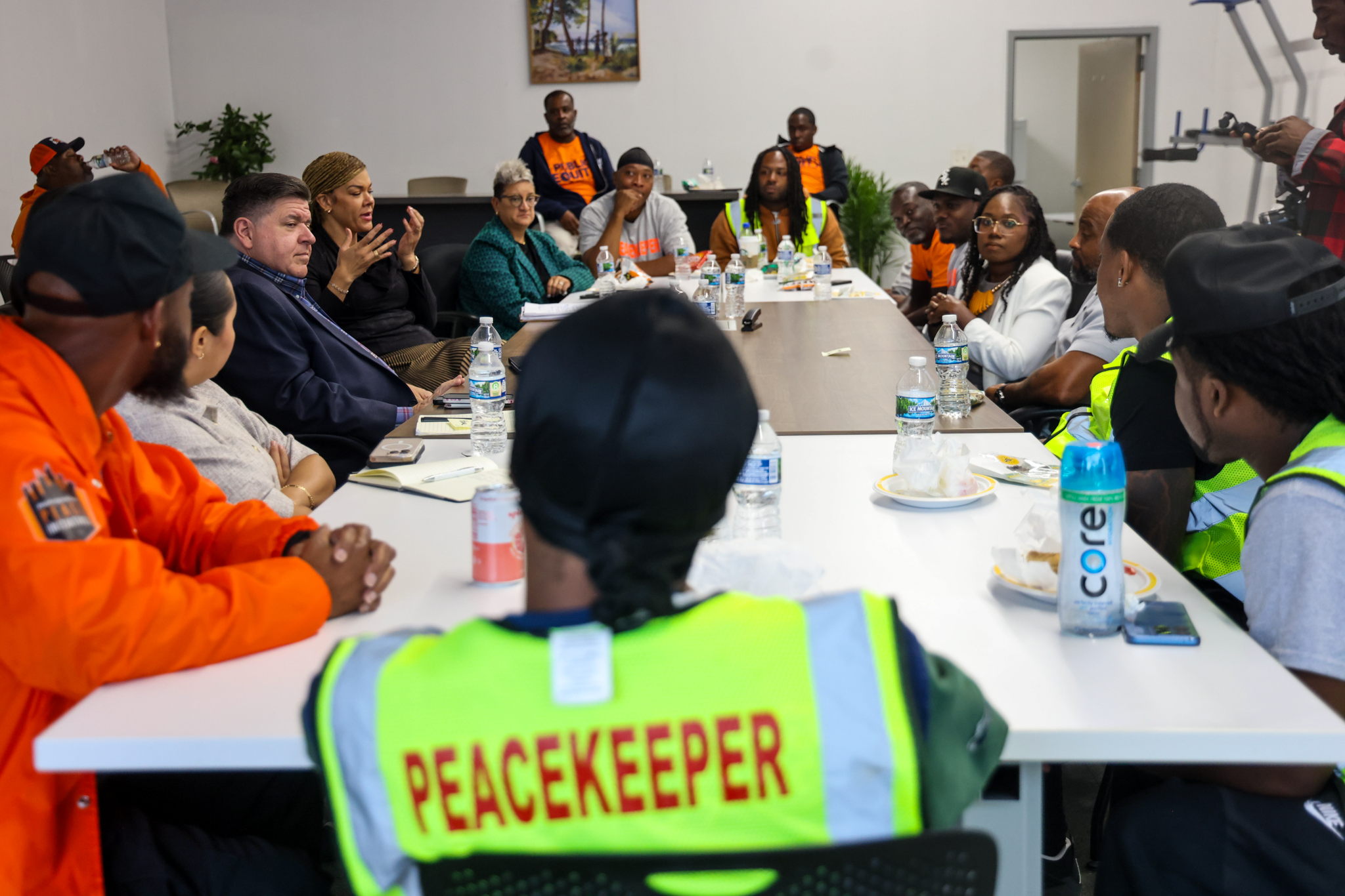 Gov. Pritzker listens to outreach workers at Public Equity in Englewood. (Office of the Governor)