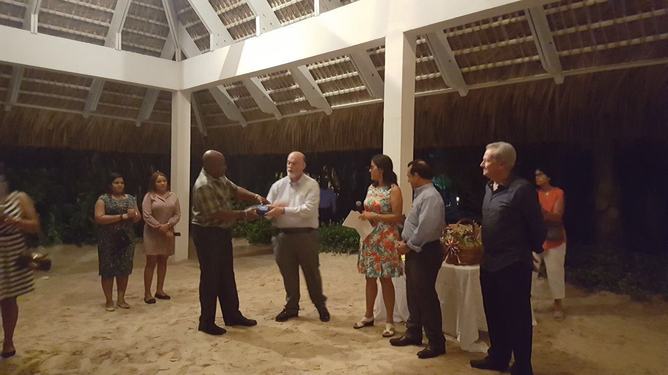 George Alcee, Agriculture Specialist of the OECS receiving an award.