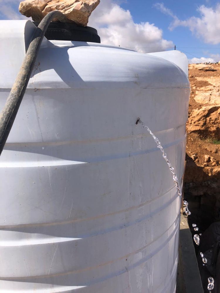 Water tanks with bullet holes, caused by settlers shooting at homes, herd, and water tanks, according to the community in South Hebron Hills, West Bank, Occupied Palestinian Territories. Copyright MSF
