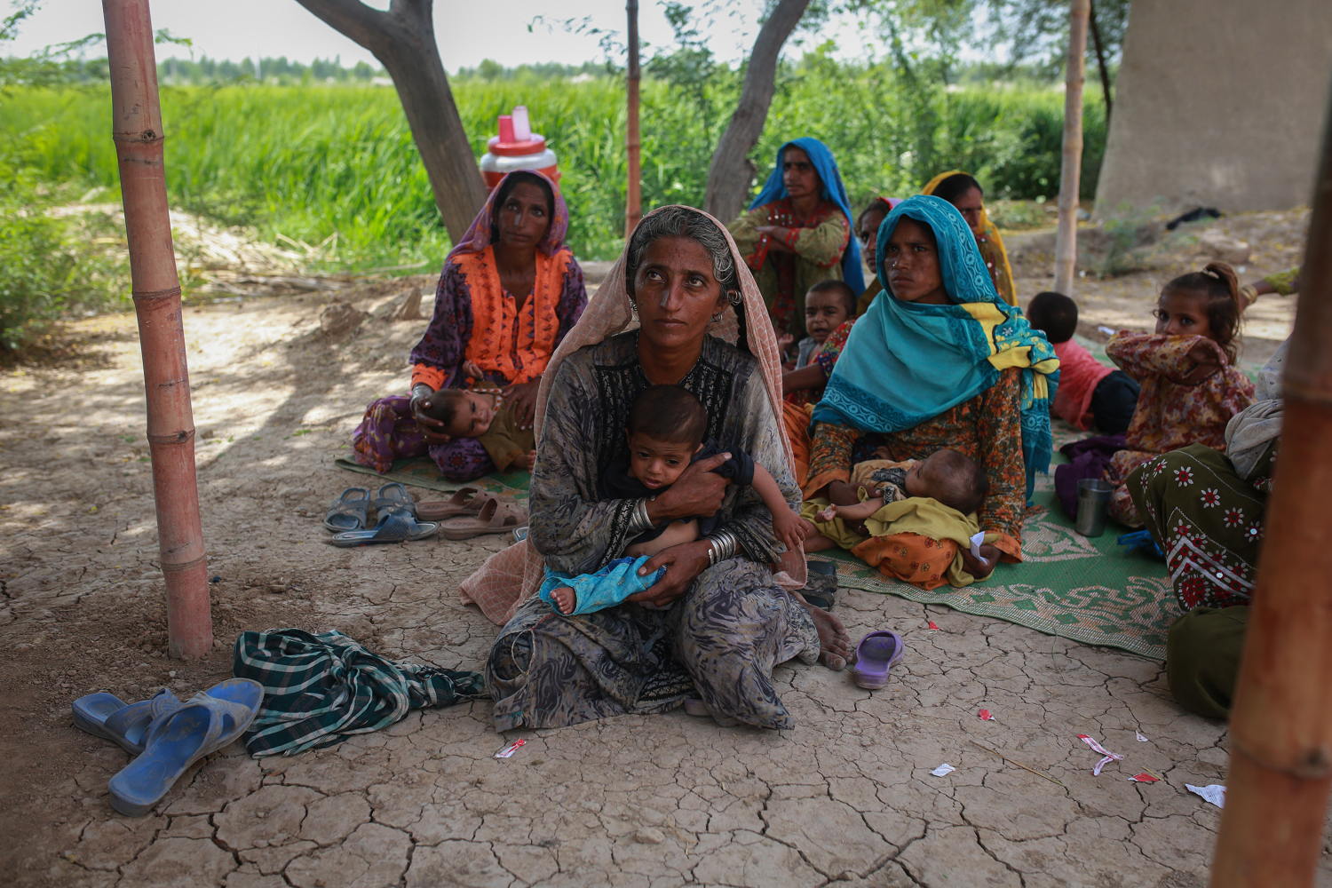 Muradi hold her eighteenth child as she wait for a checkup at the mobile clinic set up at Sikandarabad, district Naseerabad in Balochistan province, Pakistan. Photographer: Sara Farid
