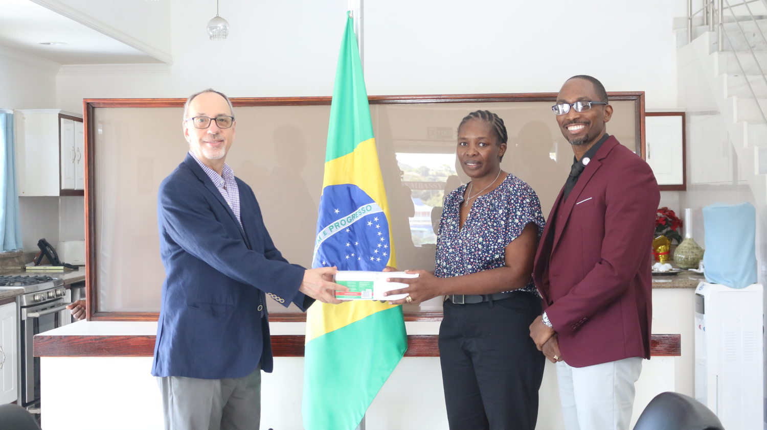 Brazilian Ambassador H.E. Mr. Anuar Nahes, Head of the OECS Pool Procurement Services Roselyne Opel, and Senior Technical Specialist at the OECS Pharmaceutical Procurement Service Mr. Abraham S. Weekes.