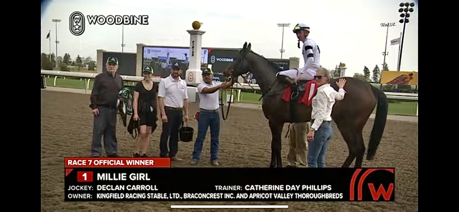 Helen Savostenko in the winner's circle with Millie Girl