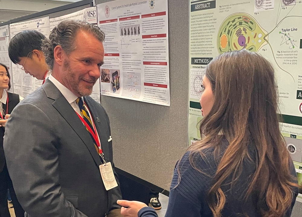 UCO student Lauren Sowards discusses her research with UCO President Todd G. Lamb.