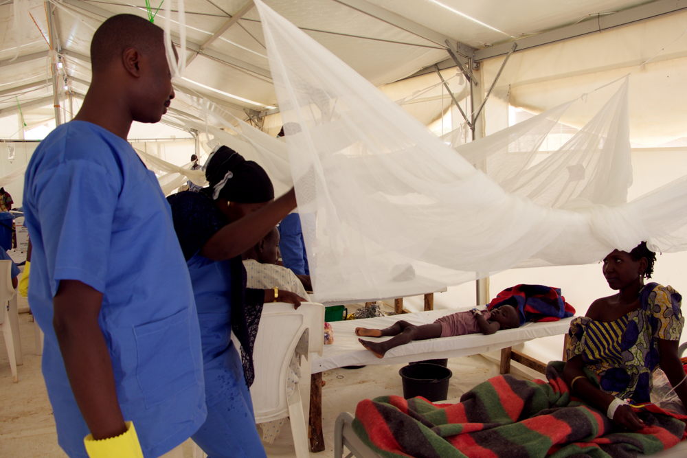 MSF health workers Aishatu and John talk to Khadija, a patient suspected of having cholera. Khadija and her husband have spent three days undergoing treatment at the Cholera Treatment Unit (CTU) in Dala, Maiduguri. The couple are internally displaced persons (IDPs) from Dikwa, Borno and currently live in Muna Camp. MSF health workers Aishatu and John talk to Khadija, a patient suspected of having cholera. Khadija and her husband have spent three days undergoing treatment at the Cholera Treatment Unit (CTU) in Dala, Maiduguri. The couple are internally displaced persons (IDPs) from Dikwa, Borno and currently live in Muna Camp.